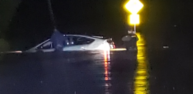 Rutherford County Sheriff's Deputy Nikolas Madore rescues a driver trapped on Sulphur Springs Road@West Buckeye Bottom Road. Driver drover around a barricade.