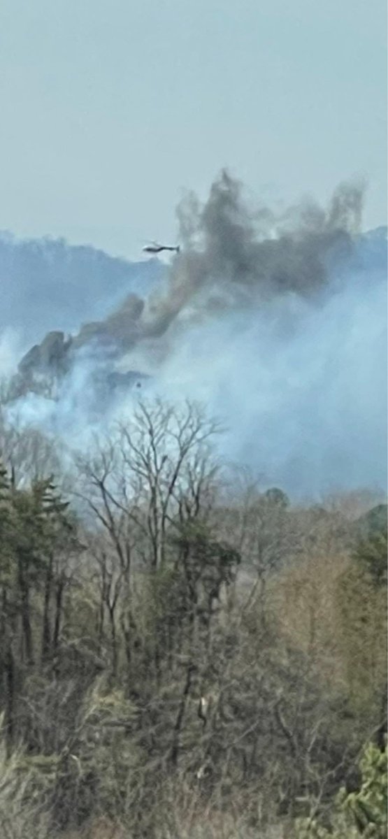 Sylvia Cook shares a pic of helicopters dumping water on fire from above.  Amanda Mckeever from her driveway off Mattox Cemetery RD