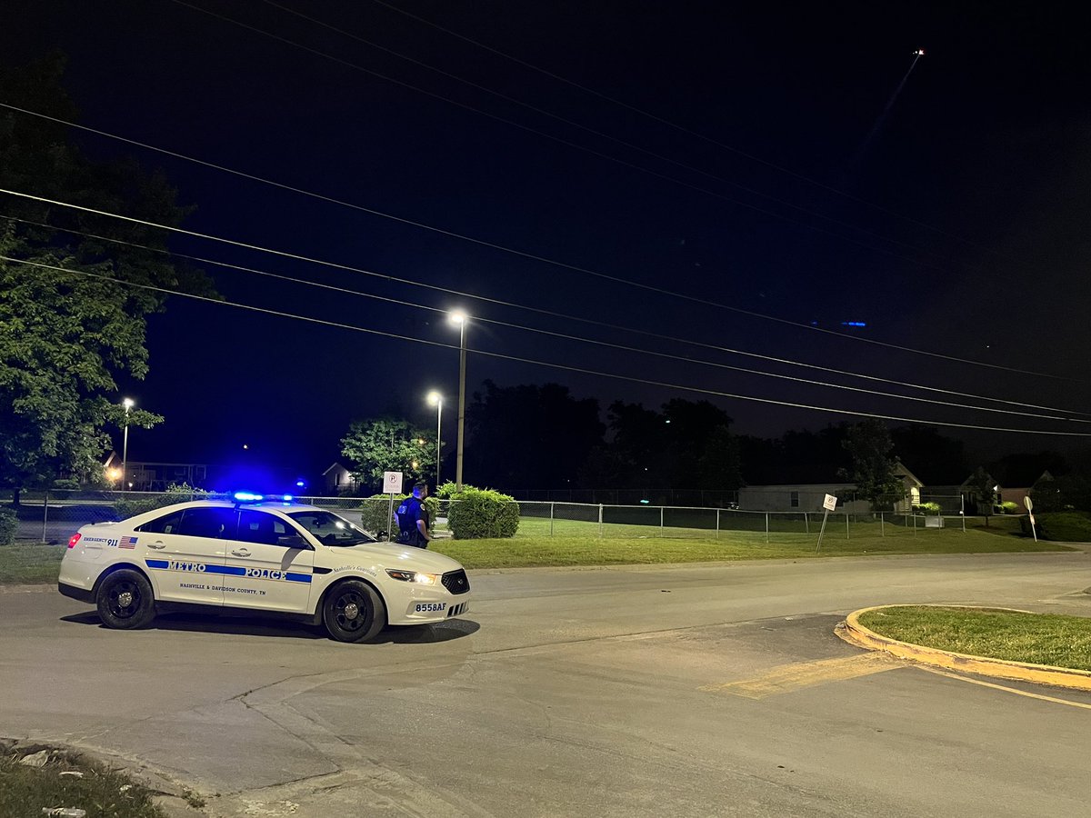 Metro Police are searching for a suspect who shot at police this morning in Bordeaux. In this picture, an officer is keeping the perimeter closed, checking each vehicle exiting the area. In the top right corner, a police helicopter searches the area