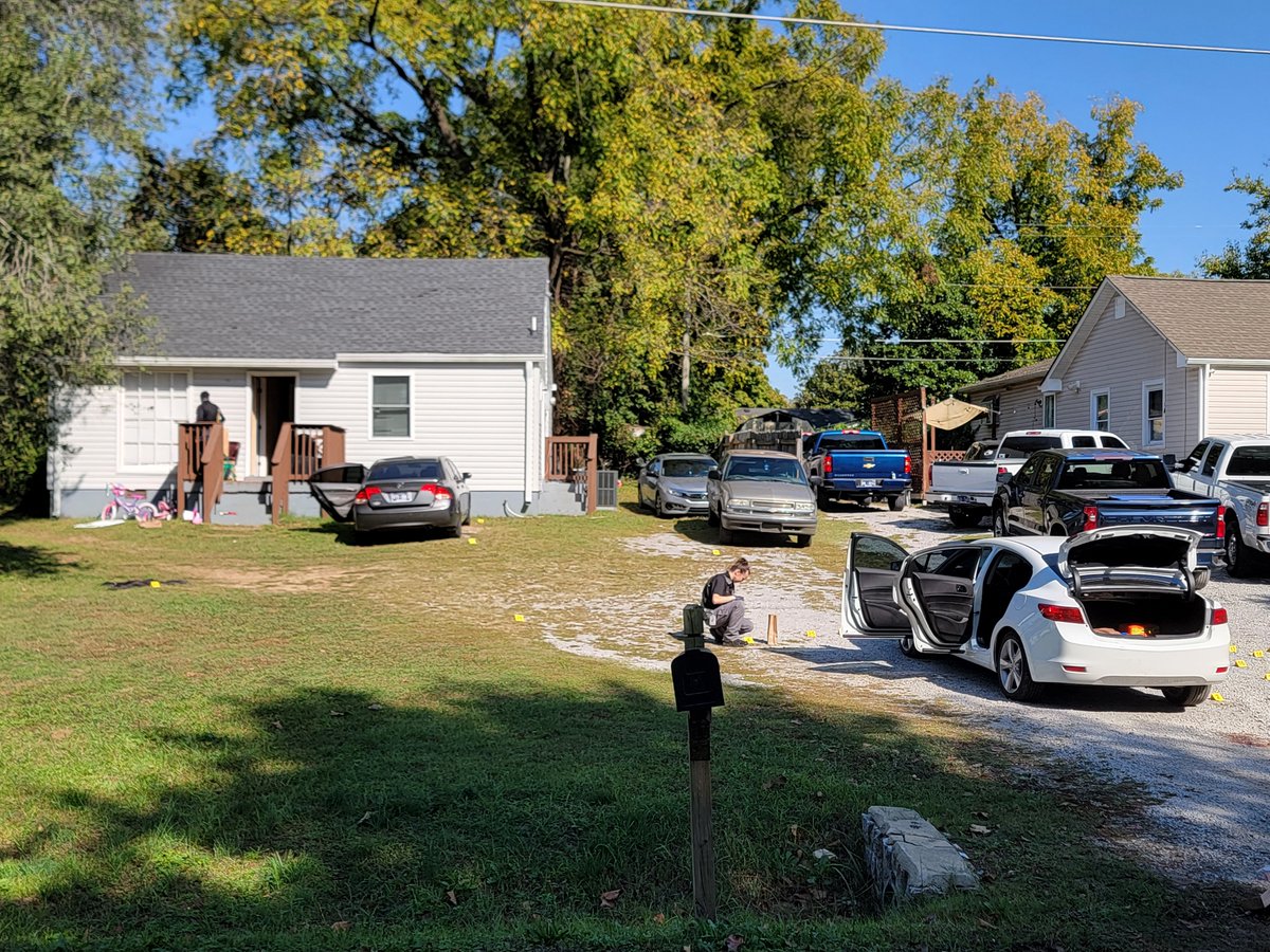 Homicide detectives are pursuing leads to locate the gunman who fatally shot 2 men overnight outside 1208 Vultee Blvd. The 2 deceased, ages 37 & 29, arrived in the white car & had a dispute with 1 of the residents who shot them in the driveway before fleeing